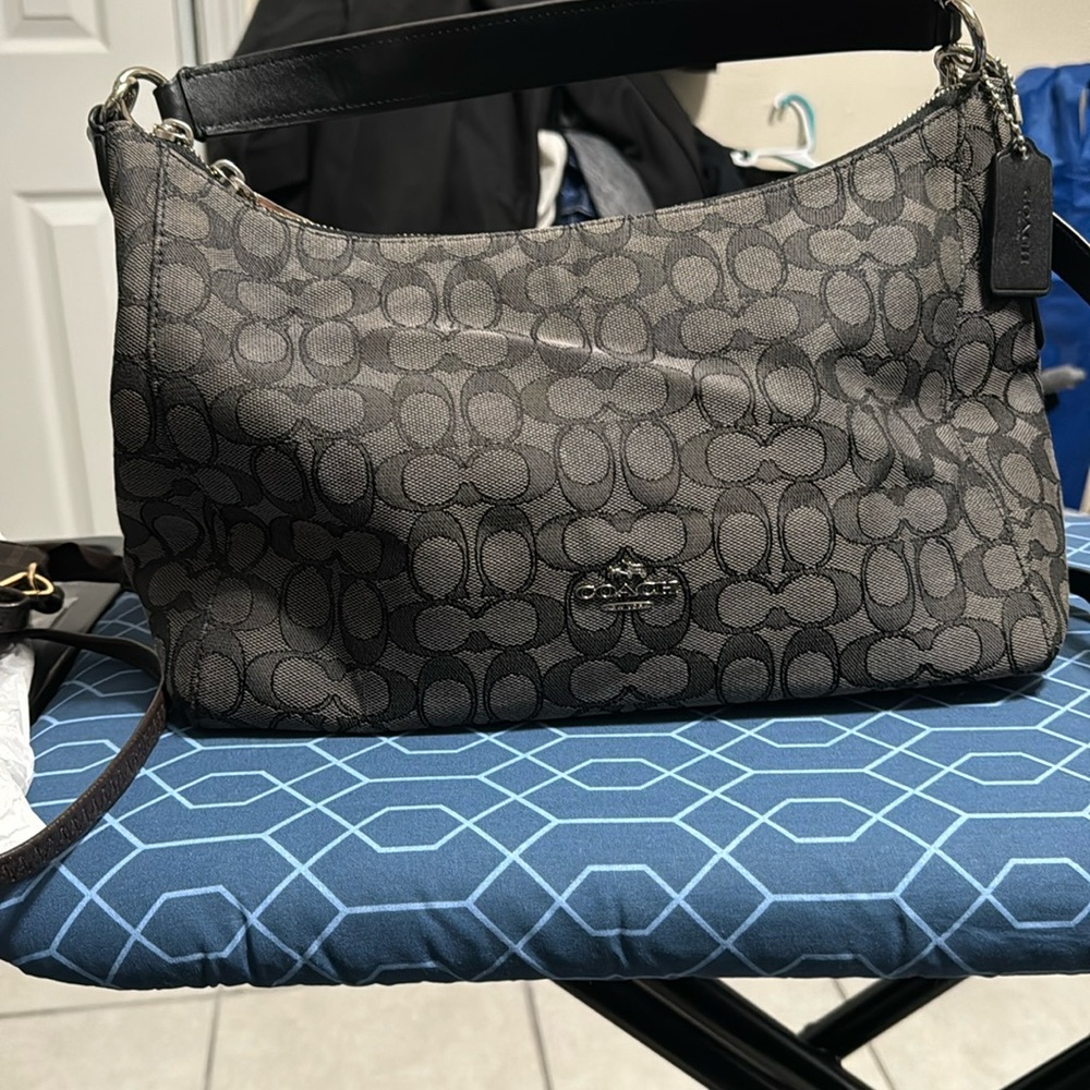 Zippered black fabric coach purse with leather straps